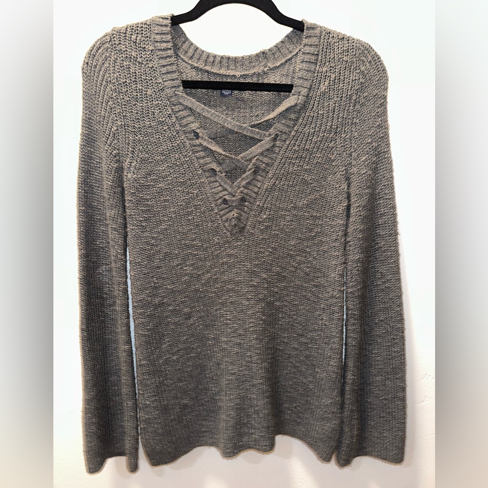 Cozy sweater with tie up accent! Lightly worn.